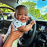 Jaevon joined the competition — help win amazing prizes! adult_hand, automobile, baby, blue_sky, car, child, closeup, clouds, dashboard, driver_seat, family, happy, infant, outdoor, portrait, short_sleeves, smiling, steering_wheel, trees, vehicle