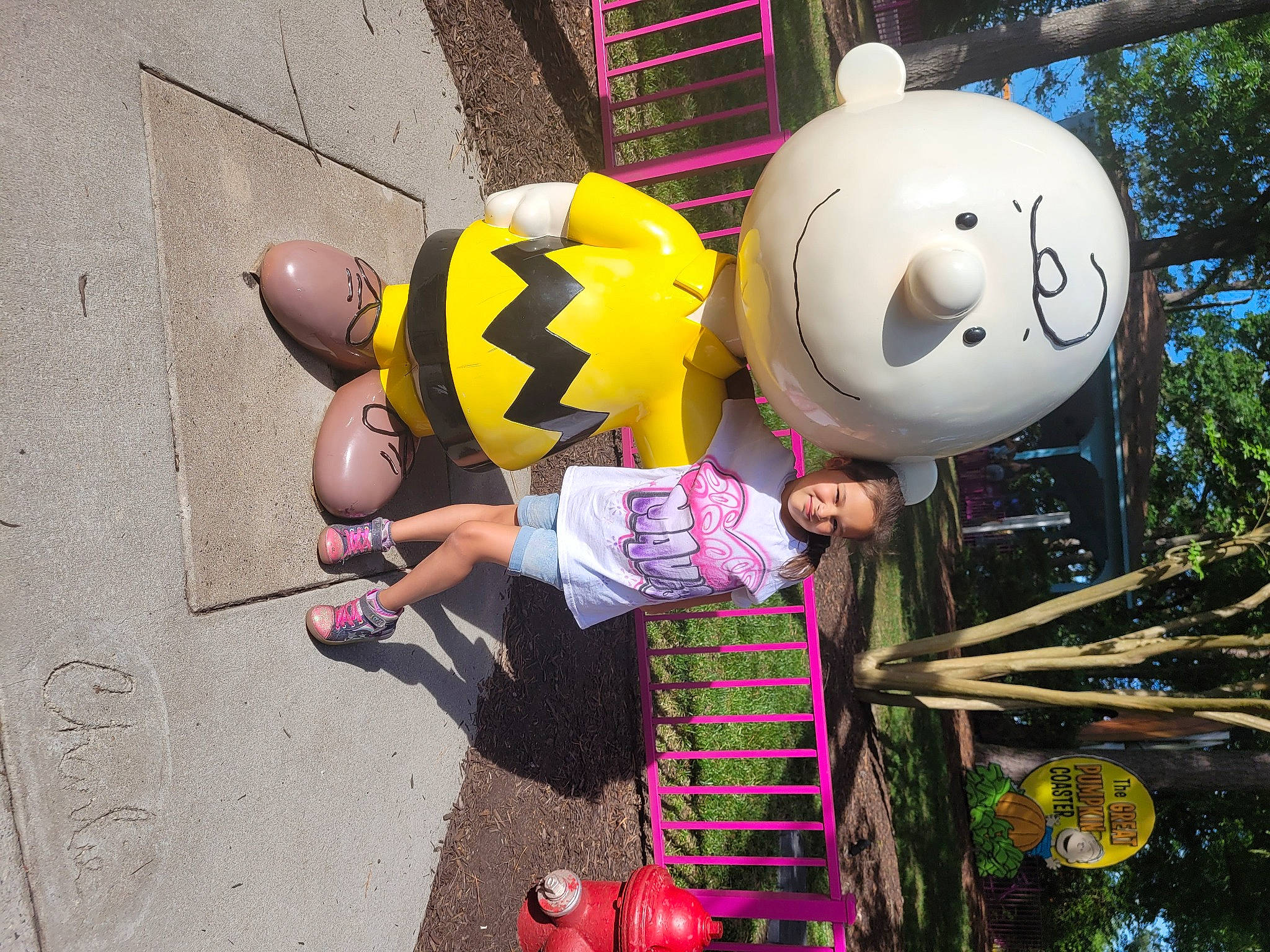 Mavis is registered to the contest to win money with this photo: ball, bicycle_helmet, child, emoticon, fun, happy, helmet, joy, leisure, magenta, person, personal_protective_equipment, pink, play, recreation, smile, tire, toddler, toy, tree