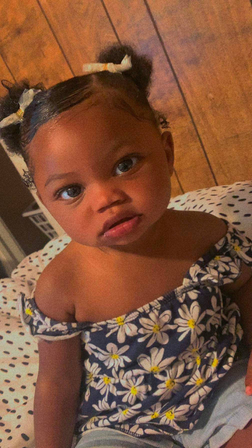 Princess is registered to the contest to win money with this photo: black_hair, cheek, chin, dress, eye, eyebrow, eyelash, face, hair, hairstyle, happy, head, iris, lip, mouth, neck, nose, person, skin, toddler