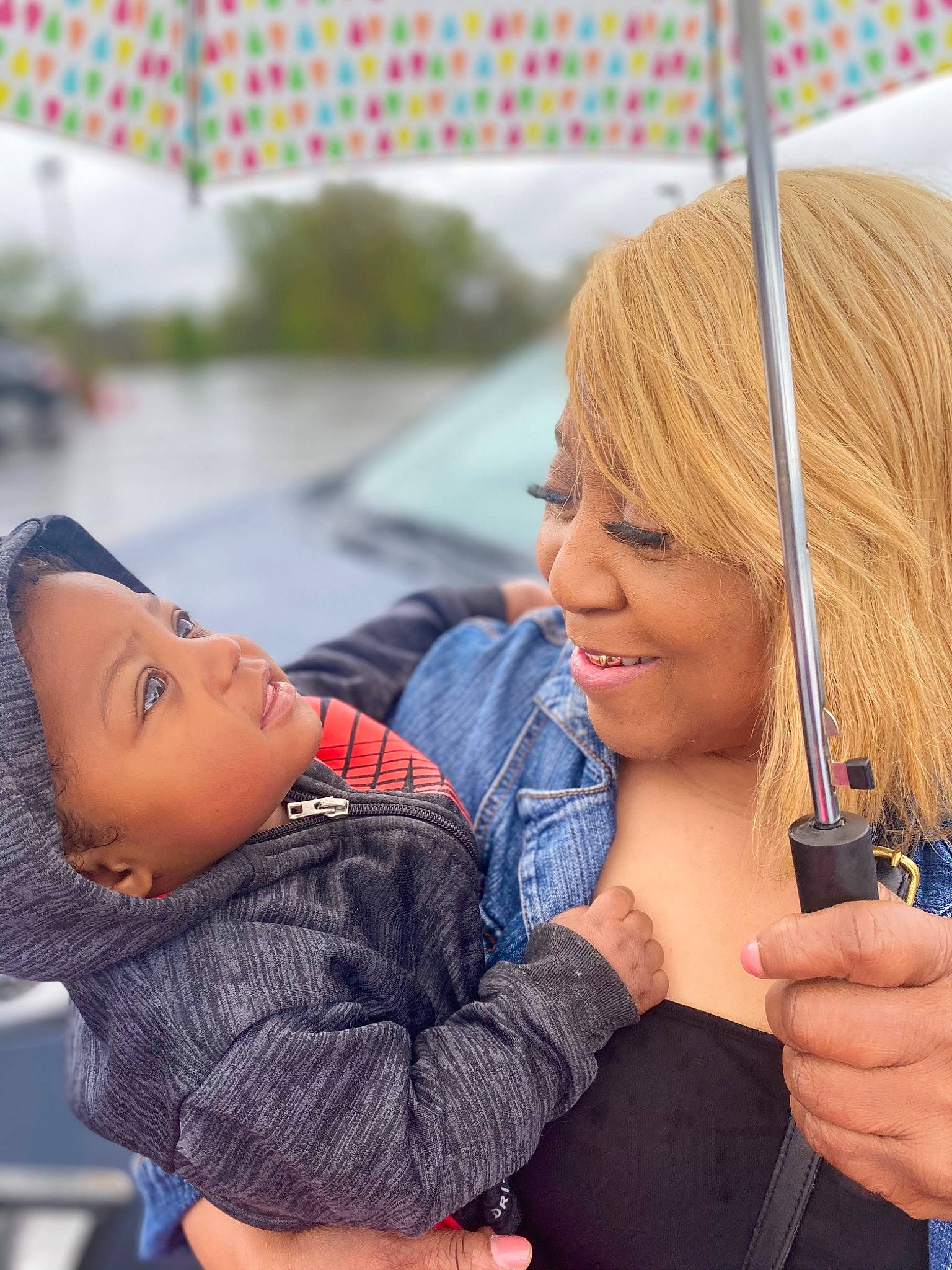 Isreal is registered to the contest to win money with this photo: bangs, brown_hair, child, denim, electric_blue, fashion_accessory, fun, gesture, glove, hand, happy, headwear, joy, layered_hair, leisure, lip, mobile_phone, muscle, person, recreation