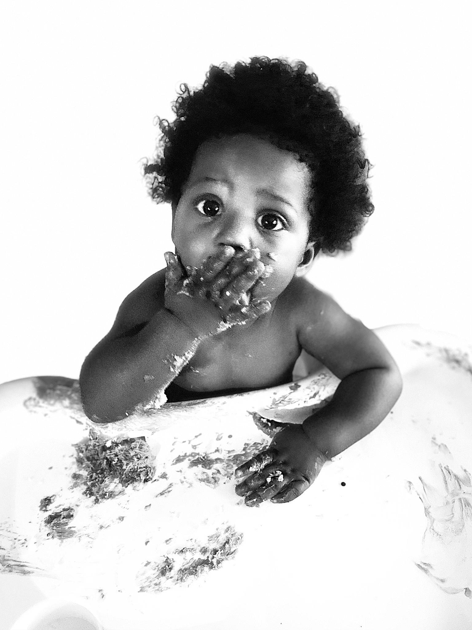 Isreal is registered to the contest to win money with this photo: afro, arm, bathing, black_and_white, eyebrow, face, flash_photography, gesture, hairstyle, happy, head, iris, jaw, liquid, mouth, nose, person, skin, smile, style