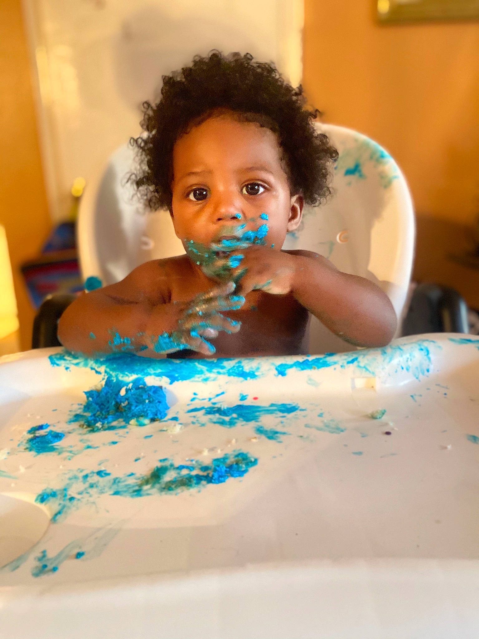 Isreal is registered to the contest to win money with this photo: baby, bathing, birthday, cake, cake_decorating, child, event, eyelash, fun, furniture, happy, icing, leisure, person, plate, sugar_cake, sugar_paste, sweetness, table, tableware