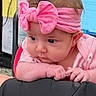 Raylynn is registered to the contest to win money with this photo: baby, pink_bow, headband, infant, cute, indoor, closeup, resting, clothing, hands, face, expression, soft_lighting, curious, child, person, portrait, small_hands, young, adorable