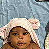 baby, child, towel, pink, hood, ears, face, eyes, skin, blanket, blue, lying_down, cute, infant, portrait, expression, indoors, soft, closeup, adorable
