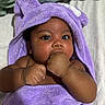 baby, child, towel, purple, face, hand, skin, cute, portrait, infant, eyes, expression, blanket, bed, sleepwear, fingers, soft, warm, indoors, newborn