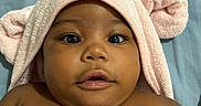 Naela is registered to the contest to win money with this photo: baby, child, towel, pink, cute, face, eyes, skin, portrait, infant, wrapped, soft, lying, expression, head, ears, mouth, closeup, indoors, blanket