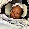 Naela is registered to the contest to win money with this photo: baby, sleeping, blanket, hat, car_seat, child, face, cozy, comfort, infant, cute, peaceful, resting, headwear, portrait, soft, warm, wrapped, indoors, smiling