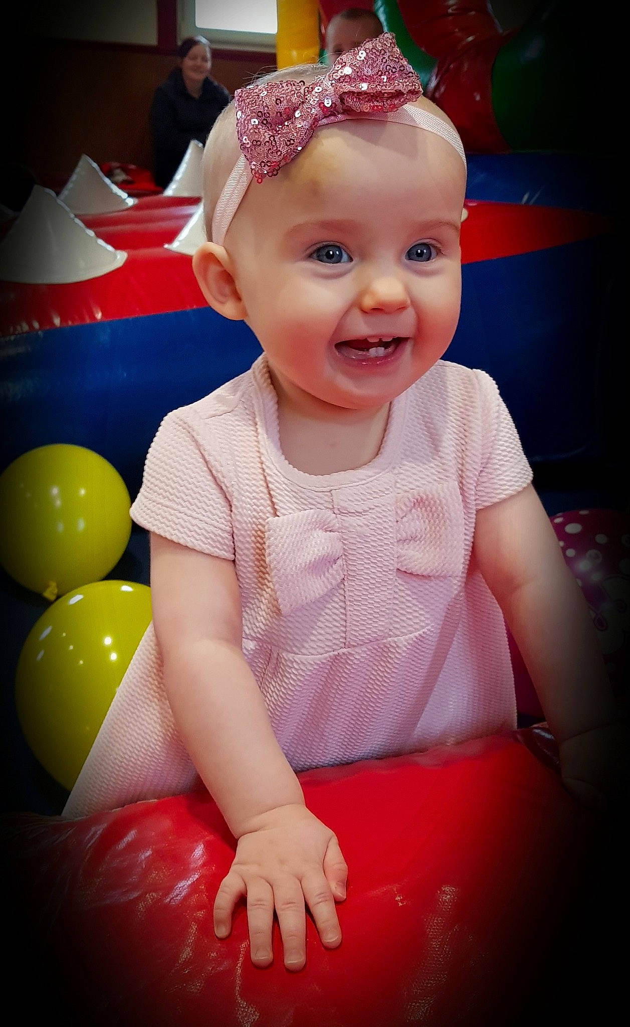 Jorgie Girl joined the competition — help win amazing prizes! baby, cheek, child, eye, face, facial_expression, fun, hair_accessory, happy, head, headgear, iris, joy, lip, party_supply, person, pink, red, skin, smile