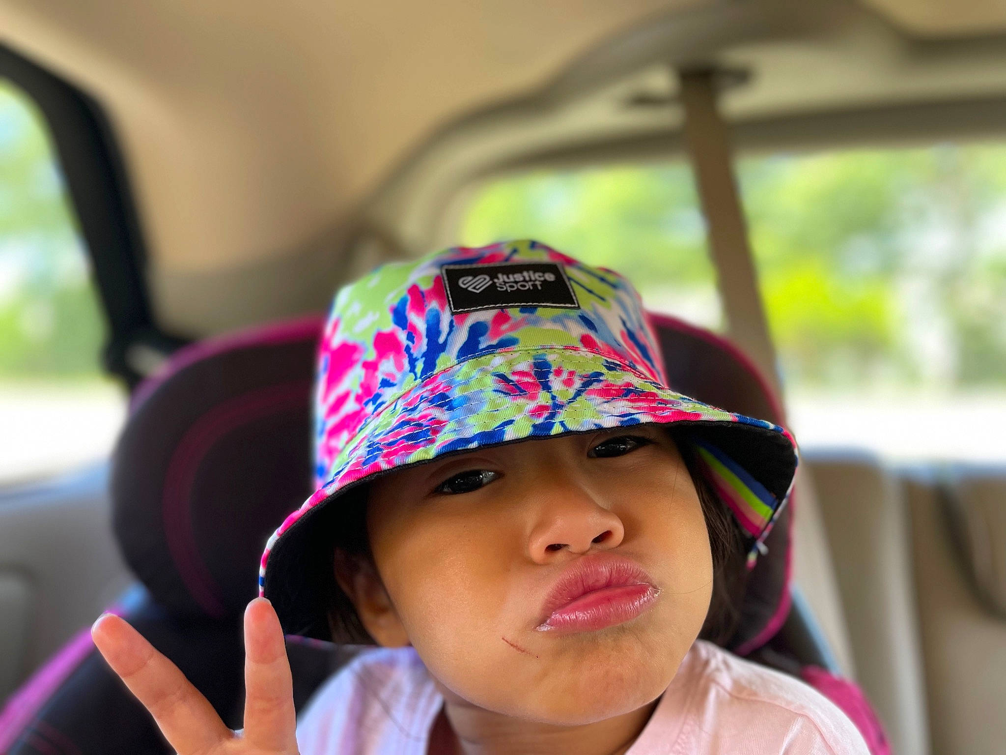 Kiliana joined the competition — help win amazing prizes! automotive_design, baby, baseball_cap, cap, car, eyewear, fashion_accessory, fun, happy, hat, headgear, headwear, leisure, lip, magenta, person, personal_protective_equipment, recreation, sun_hat, toddler