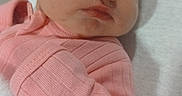 Luci is registered to the contest to win money with this photo: newborn, baby, sleeping, pink_clothing, blanket, infant, cute, peaceful, closeup, portrait, child, soft, cozy, resting, indoors, human, person, tiny, fresh, adorable