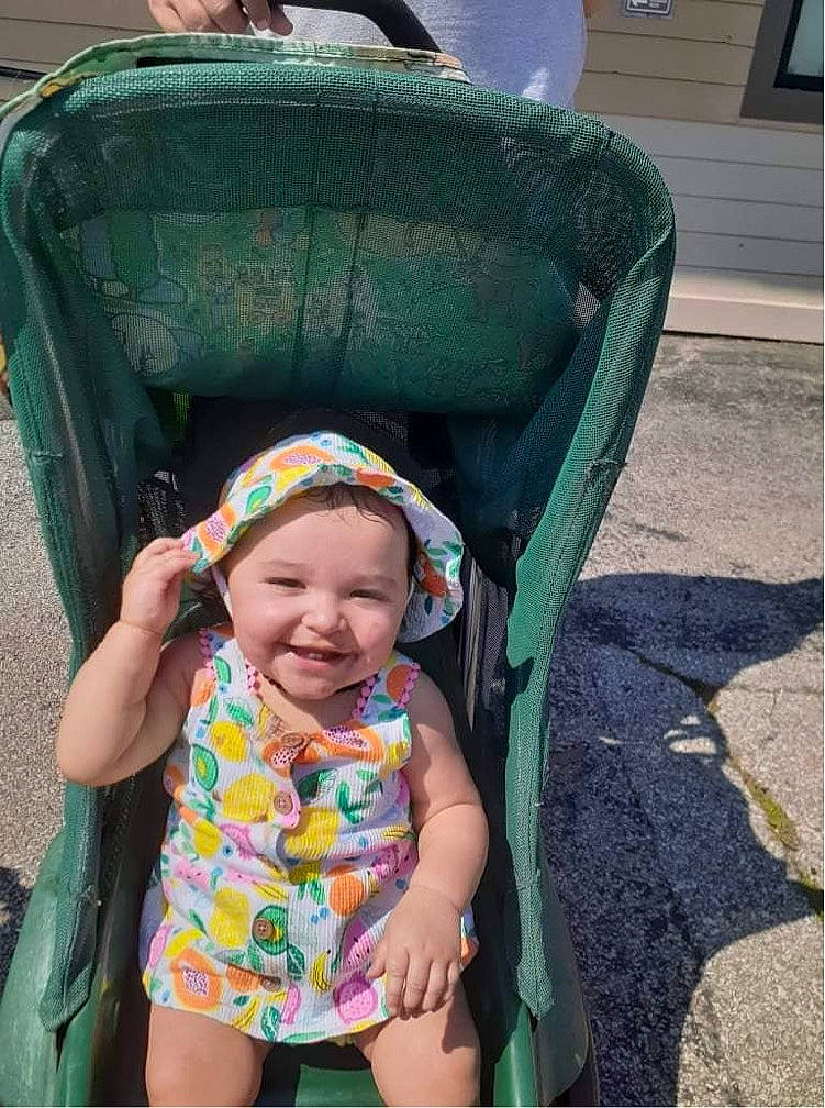 Pennilane is registered to the contest to win money with this photo: baby, baby_carriage, baby_products, baby_toddler_clothing, child, facial_expression, fun, grass, green, hairstyle, happy, headwear, joy, leisure, pattern, person, play, recreation, sitting, smile