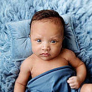 Liam joined the competition — help win amazing prizes! baby, background_blur, blue_blanket, closeup, cozy, cute, expression, eyes, face, hair, infant, lying_down, newborn, pillow, portrait, skin, small_hands, soft_texture, studio_photography, swaddle