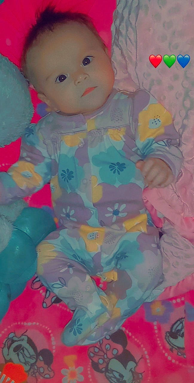 Mazikeen is registered to the contest to win money with this photo: baby, baby_products, baby_toddler_clothing, baby_toys, cheek, child, doll, fun, happy, magenta, pattern, peach, person, pink, plastic, sitting, skin, sleeve, stuffed_toy, toddler