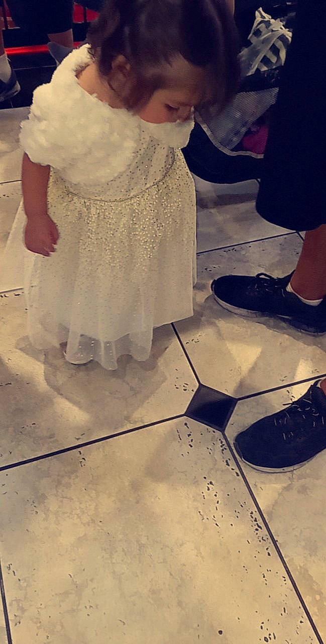 Aurora is registered to the contest to win money with this photo: bridal_accessory, child, cool, dress, embellishment, event, fashion_accessory, fashion_design, floor, flooring, formal_wear, fun, happy, headpiece, human_leg, pattern, peach, person, tints_and_shades, toddler