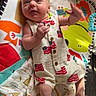 Hudson is registered to the contest to win money with this photo: baby, infant, play_mat, romper, american_flag, toy, colorful, pattern, blanket, hand, foot, lying_down, child, cute, indoors, soft_light, fabric, sleepwear, newborn, playtime
