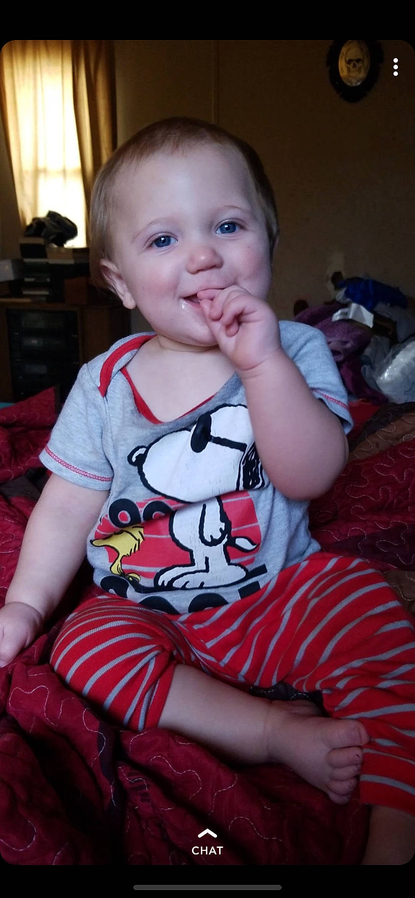 Justus is registered to the contest to win money with this photo: boy, cheek, child, day, eye, face, facial_expression, girl, hair, head, human_hair_color, infant, joy, person, pink, product, red, sitting, skin, smile