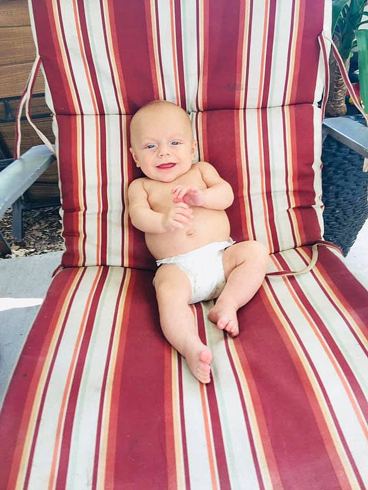 Kasyn is registered to the contest to win money with this photo: baby, car, child, dress, furniture, joy, leisure, peach, person, pink, plant, sitting, skin, toddler, vacation, vehicle