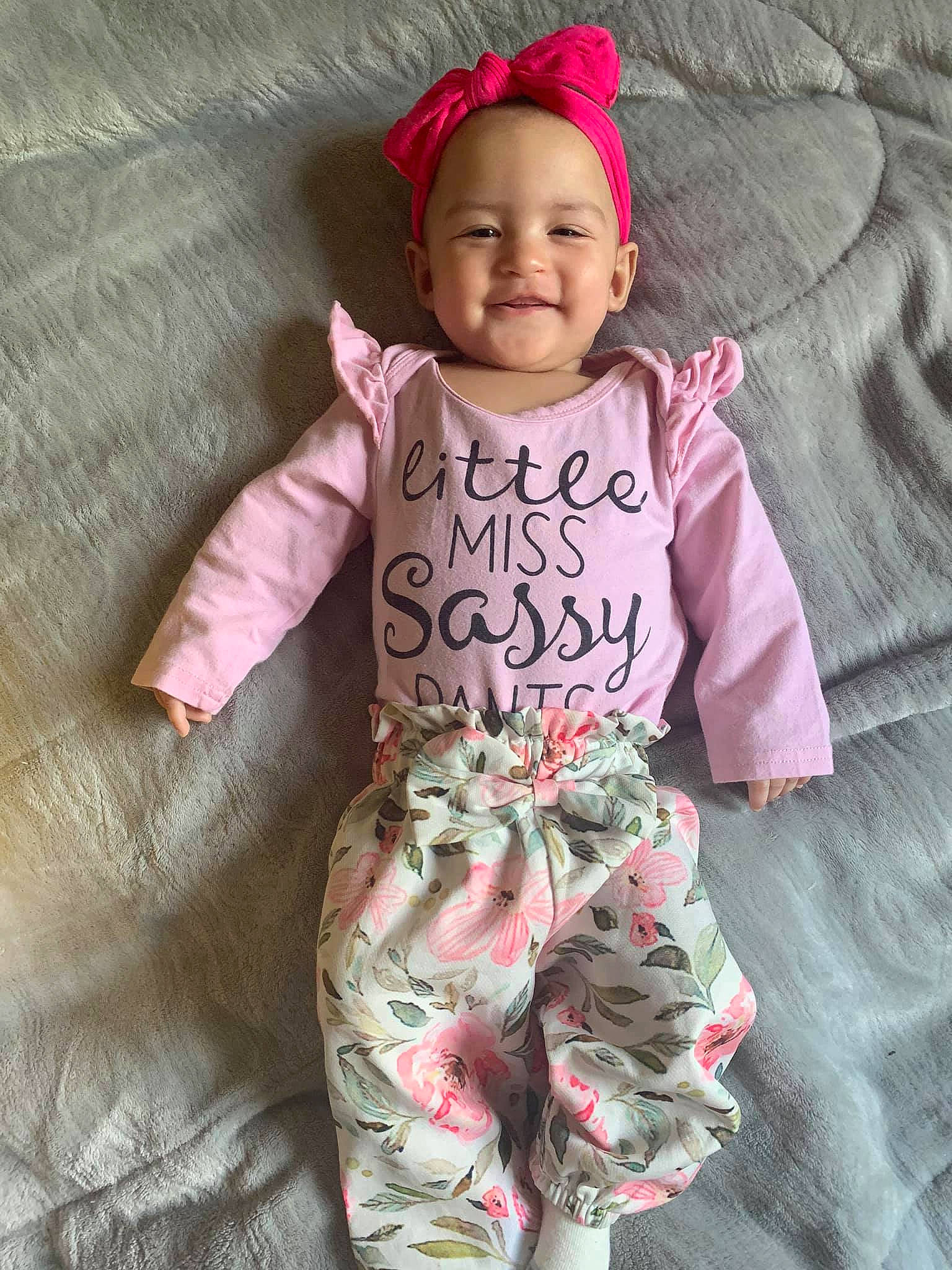 Sereniti is registered to the contest to win money with this photo: baby, baby_products, baby_toddler_clothing, child, clothing, dress, joy, outerwear, pajamas, pattern, person, pink, product, sleeve, smile, toddler