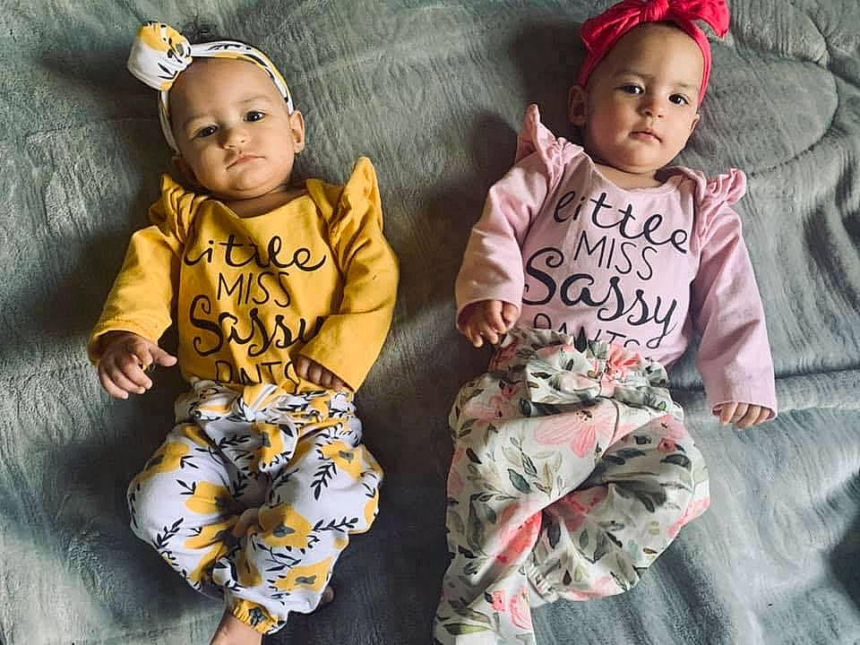 Sereniti joined the competition — help win amazing prizes! baby, baby_products, baby_toddler_clothing, child, child_model, hair_accessory, headband, outerwear, pajamas, pattern, person, product, sibling, sleeve, smile, textile, toddler, yellow