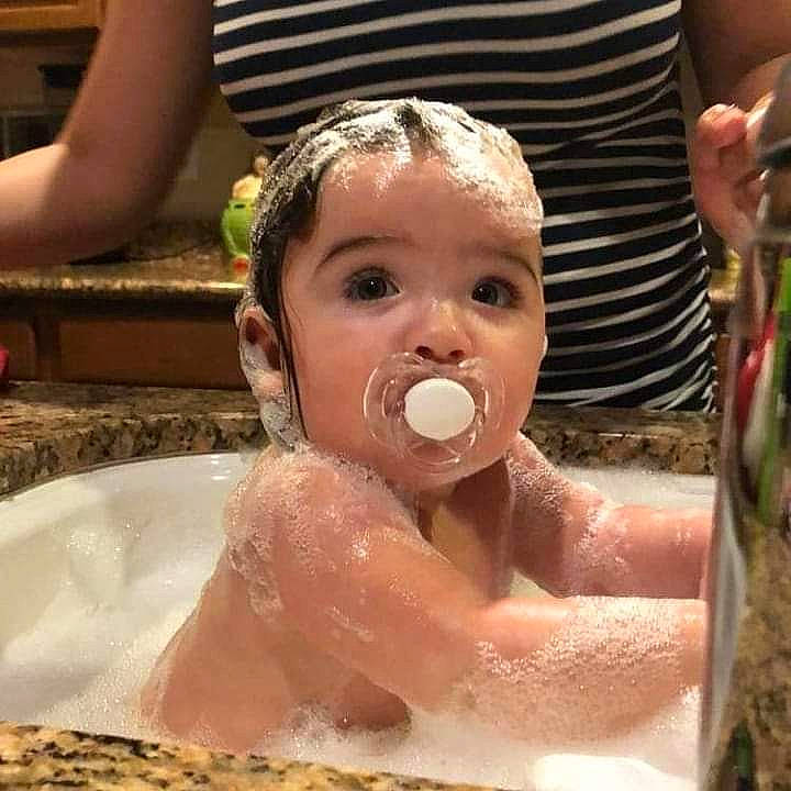 Marceline is registered to the contest to win money with this photo: baby, baby_bathing, bathing, child, face, fun, person, toddler, washing, water