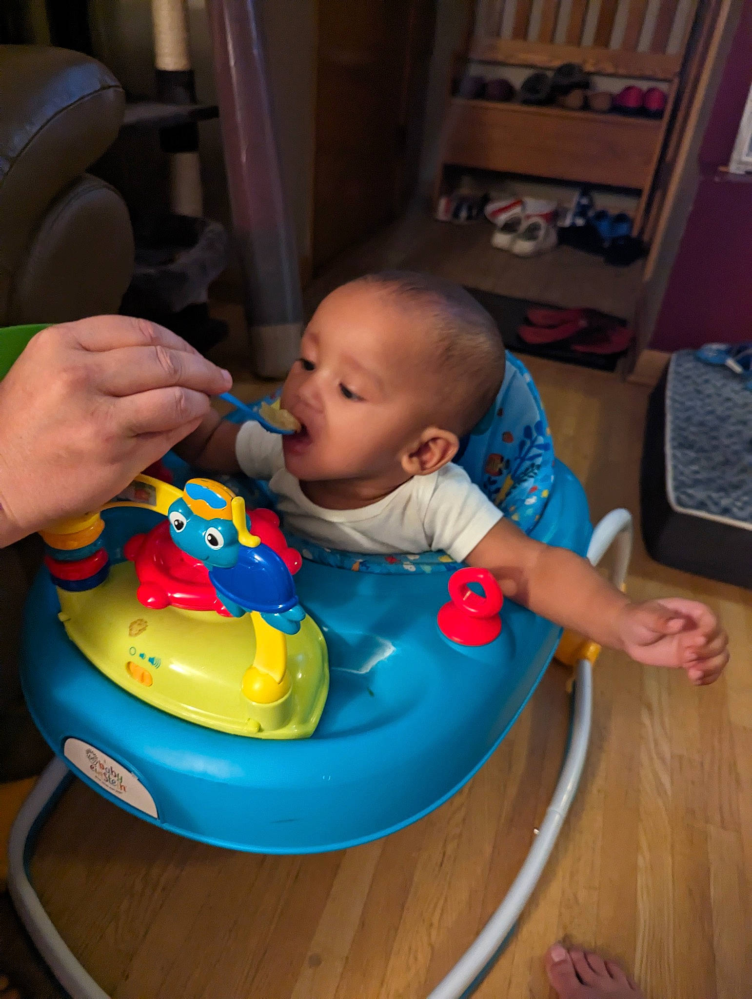 Ta'Mir is registered to the contest to win money with this photo: baby, baby_products, baby_toddler_clothing, baby_toys, bib, chair, child, flooring, fun, hardwood, head, leisure, person, plastic, play, room, sitting, skin, toddler, varnish