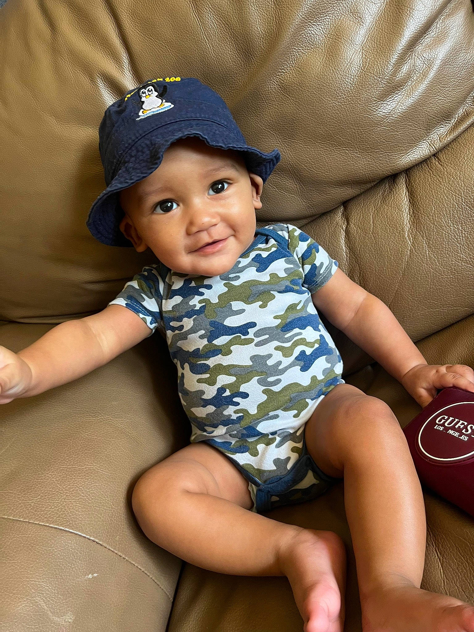 Ta'Mir is registered to the contest to win money with this photo: baby_toddler_clothing, baseball_cap, cap, child, comfort, cool, electric_blue, face, flash_photography, hat, headwear, human_leg, knee, leg, pattern, person, shorts, skin, sleeve, sun_hat