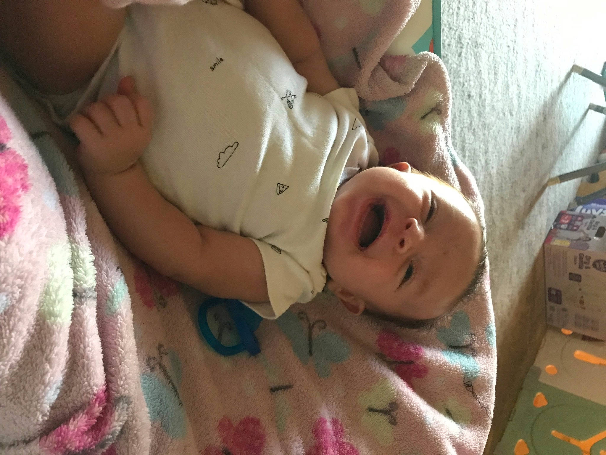 Journey is registered to the contest to win money with this photo: abdomen, baby, baby_toddler_clothing, bedding, bedtime, cheek, chest, child, comfort, finger, flesh, happy, hat, linens, mouth, nail, person, skin, smile, thumb