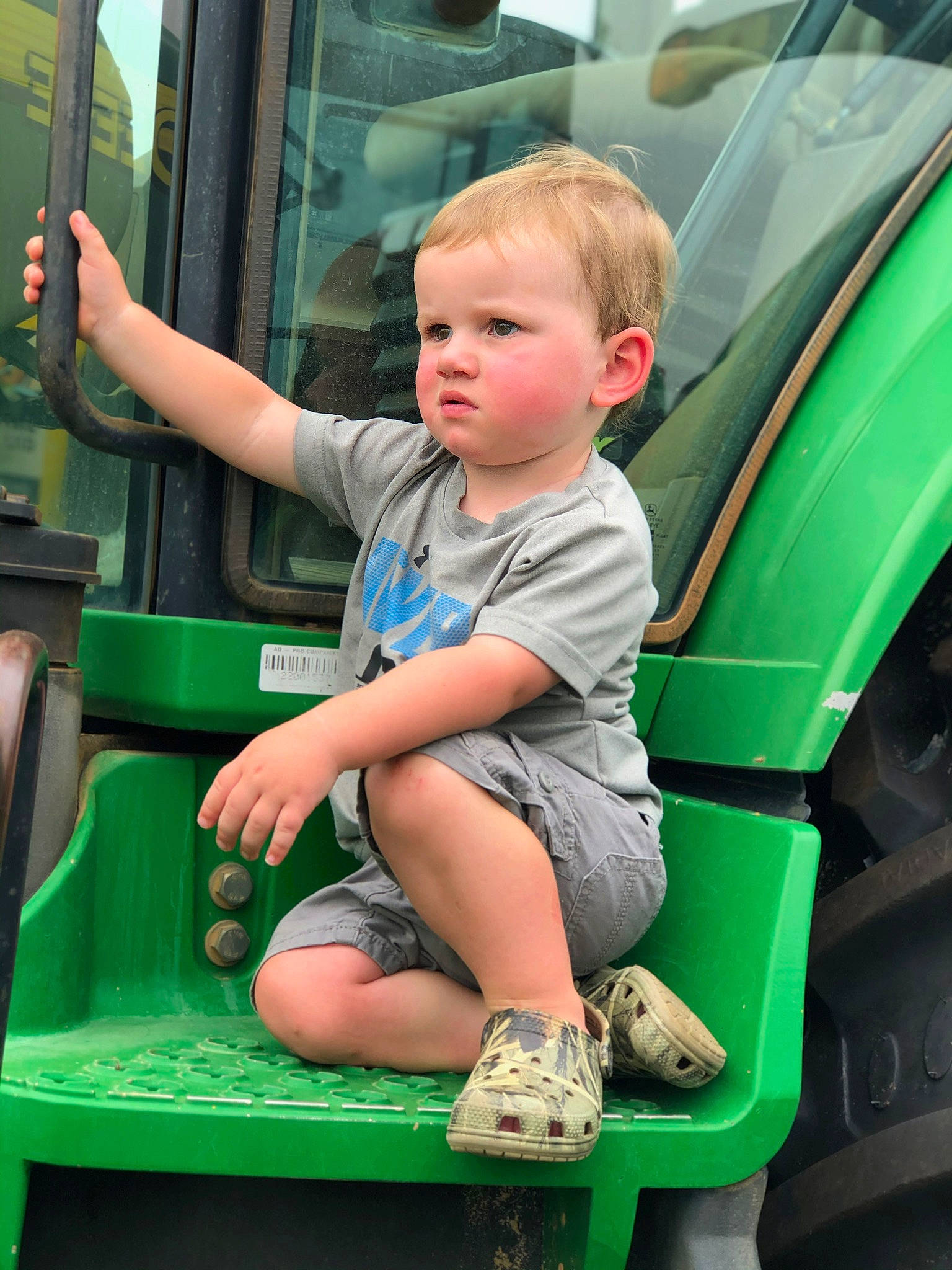 Bryar joined the competition — help win amazing prizes! child, green, motor_vehicle, person, play, sitting, toddler, vehicle, vehicle_door