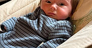 Teddy joined the competition — help win amazing prizes! baby, baby_seat, carpet, child, closeup, comfort, cushion, expression, face, furniture, hair, home, indoor, infant, person, portrait, relaxing, soft_light, striped_clothing, young