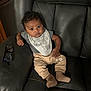 Braxton joined the competition — help win amazing prizes! baby, child, face, eyes, bib, pants, bear_design, socks, chair, leather, glasses, indoor, portrait, cute, relaxed, infant, clothing, furniture, person, young