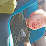 Axil joined the competition — help win amazing prizes! child, toddler, car_seat, blue, seatbelt, laughing, happy, sunlight, car_interior, green_toy, plush, blonde_hair, casual_clothing, sitting, smiling, young_child, daylight, playful, safe, seat