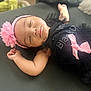 Braelynn is registered to the contest to win money with this photo: baby, sleeping, girl, headband, pink_flower, black_dress, bow, infant, peaceful, closeup, indoor, soft_light, portrait, child, cute, adorable, resting, toddler, young_child, face