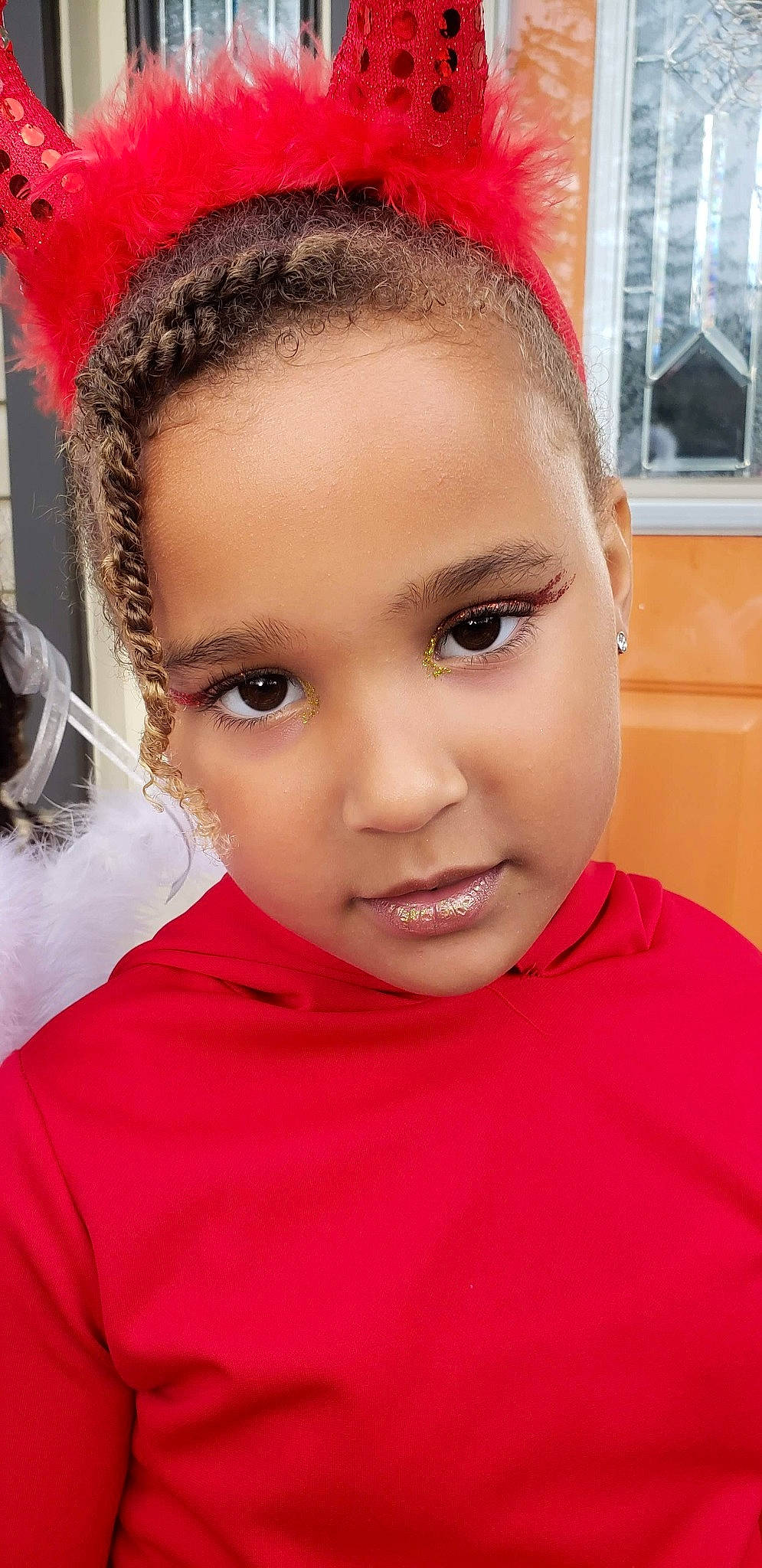 Selah is registered to the contest to win money with this photo: black_hair, cap, cheek, child, chin, close_up, ear, eyebrow, eyelash, forehead, fun, happy, headgear, headpiece, lip, nose, person, red, skin, toddler