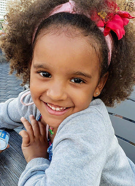 Amiyah is registered to the contest to win money with this photo: arm, black_hair, cheek, chin, cool, eye, eyebrow, eyelash, flash_photography, forehead, gesture, hair, hairstyle, happy, head, iris, joy, lip, nose, person