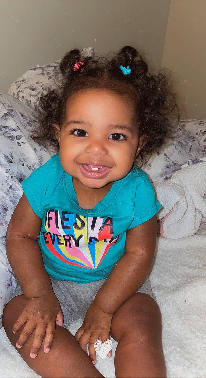 Alicsa is registered to the contest to win money with this photo: arm, baby_toddler_clothing, cheek, chin, clothing, eye, eyebrow, face, flash_photography, hair, happy, head, iris, joy, lip, mouth, neck, nose, organ, person