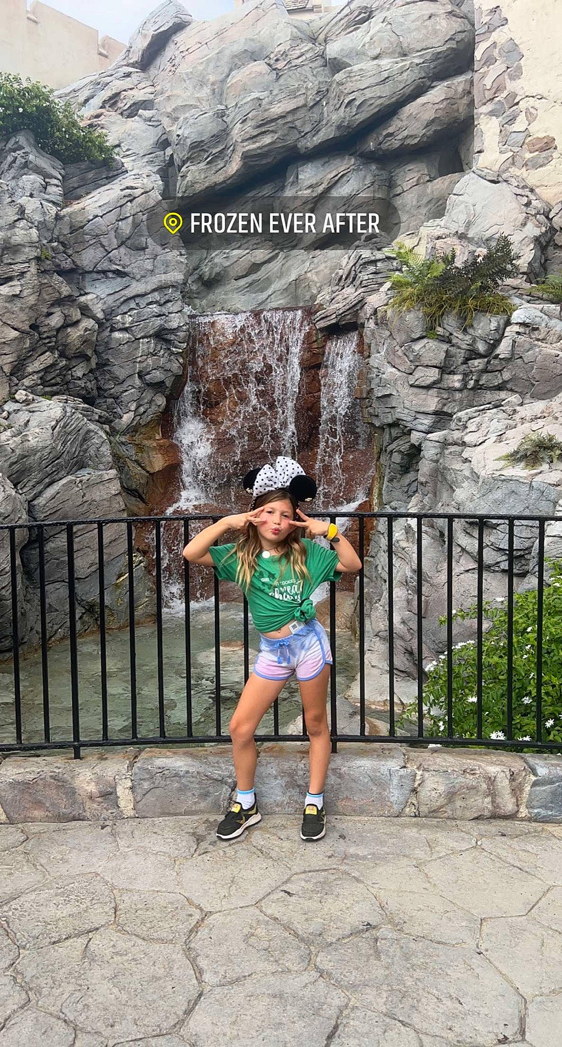 Aleah joined the competition — help win amazing prizes! bedrock, body_of_water, fence, formation, fun, happy, landscape, leisure, person, plant, public_space, recreation, shorts, temple, thigh, travel, tree, trunk, wall, wood