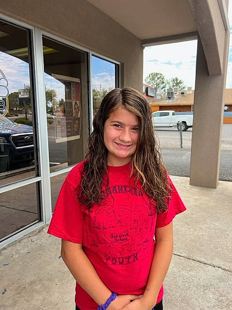 Emily is registered to the contest to win money with this photo: blond, brown_hair, design, door, electric_blue, happy, human_leg, joy, leisure, long_hair, magenta, person, shoulder, sleeve, smile, standing, thigh, travel, trunk, vehicle_door