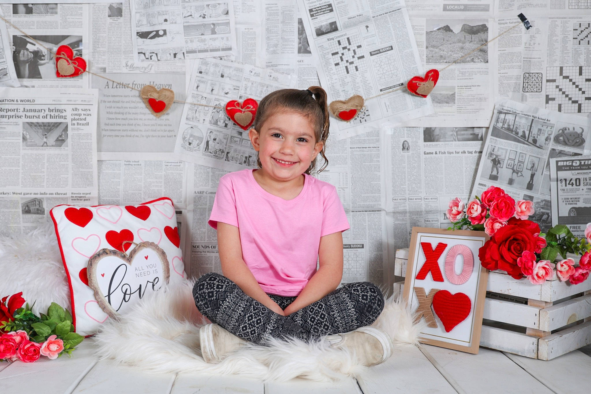 Kayla is registered to the contest to win money with this photo: beauty, carmine, event, floral_design, flower, happy, joy, magenta, pattern, person, pink, plant, red, room, sitting, sleeve, smile, sock, textile, toddler