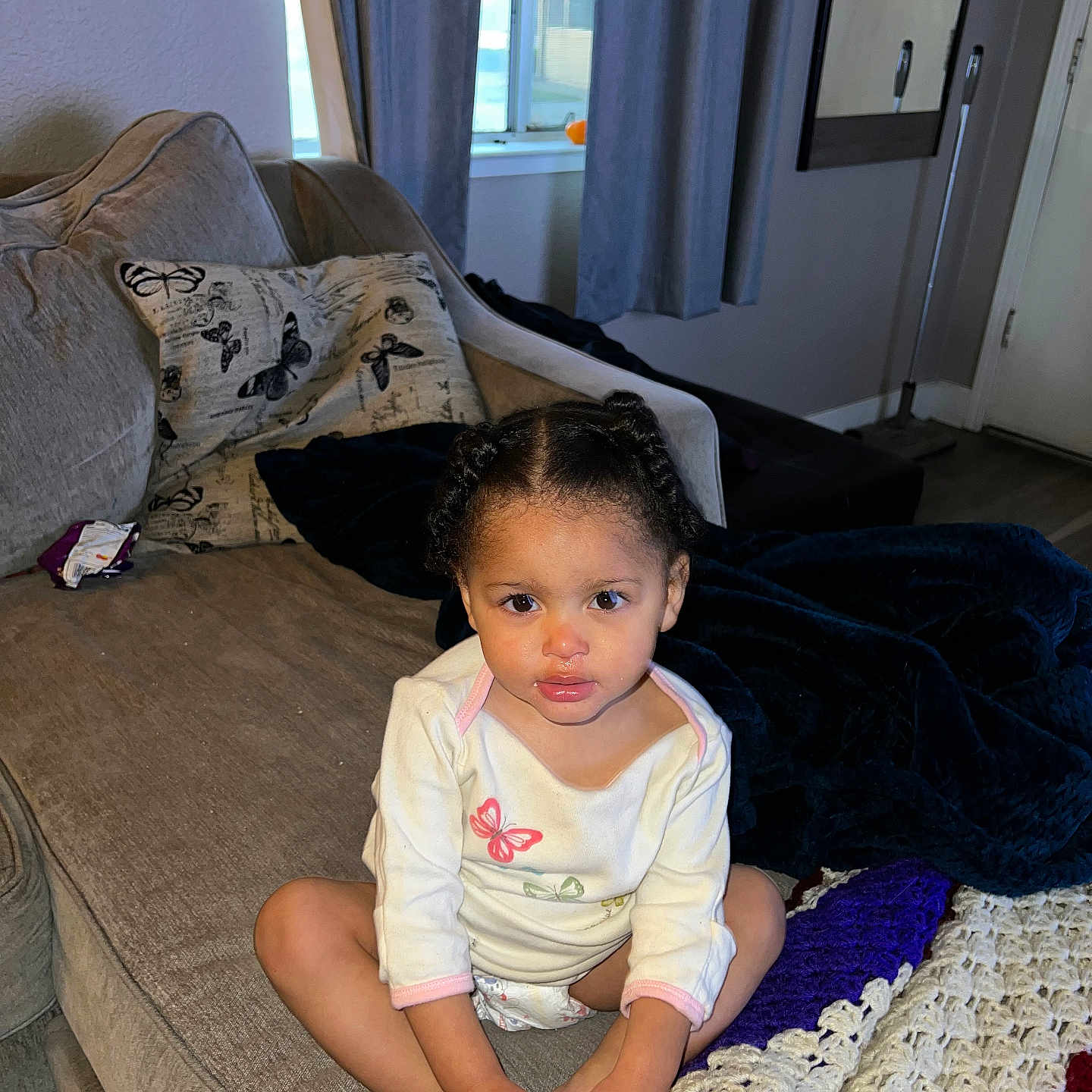 Zaniyah is registered to the contest to win money with this photo: architecture, baby, bodypart, building, couch, cushion, door, face, finger, furniture, hand, head, homedecor, indoors, livingroom, person, photography, portrait, room, sitting