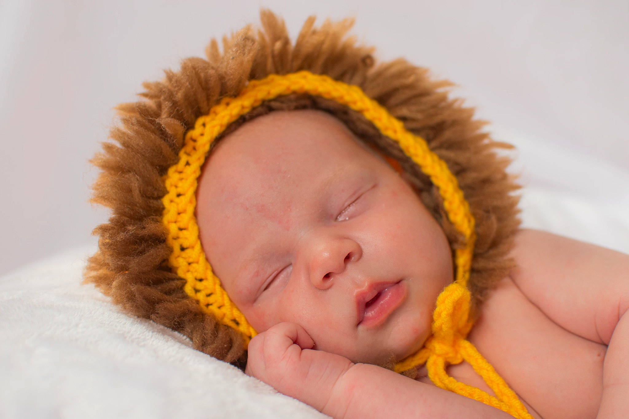 Jahseh is registered to the contest to win money with this photo: baby, baby_sleeping, cap, close_up, comfort, eye, eyebrow, eyelash, fashion_accessory, finger, fur, gesture, grass, happy, head, knit_cap, linens, people_in_nature, person, toddler