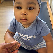 Syncere joined the competition — help win amazing prizes! baby, child, infant, holding_hand, blue_clothing, striped_headband, sitting, bench, indoor, curious_expression, person, cute, sock, hand, floor, wooden_chair, furniture, portrait, skin, headwear