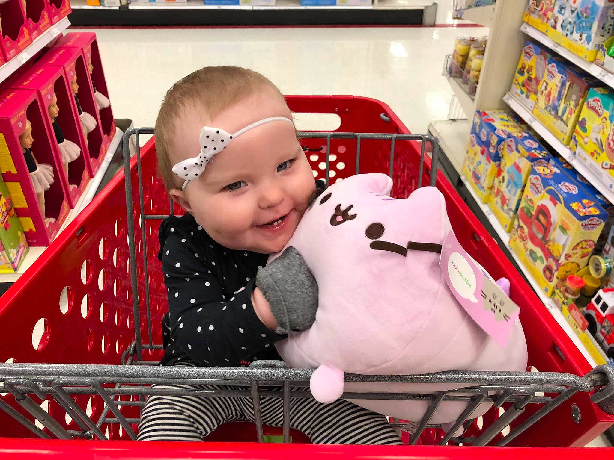 Silvia is registered to the contest to win money with this photo: baby, cart, cheek, child, christmas, christmas_eve, joy, person, product, shopping_cart, supermarket, toddler, vehicle