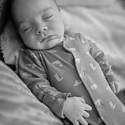 Archie joined the competition — help win amazing prizes! baby, sleeping, pajamas, hand, face, infant, blanket, cozy, soft, monochrome, portrait, peaceful, cute, child, resting, indoor, newborn, comfort, relaxation, toddler