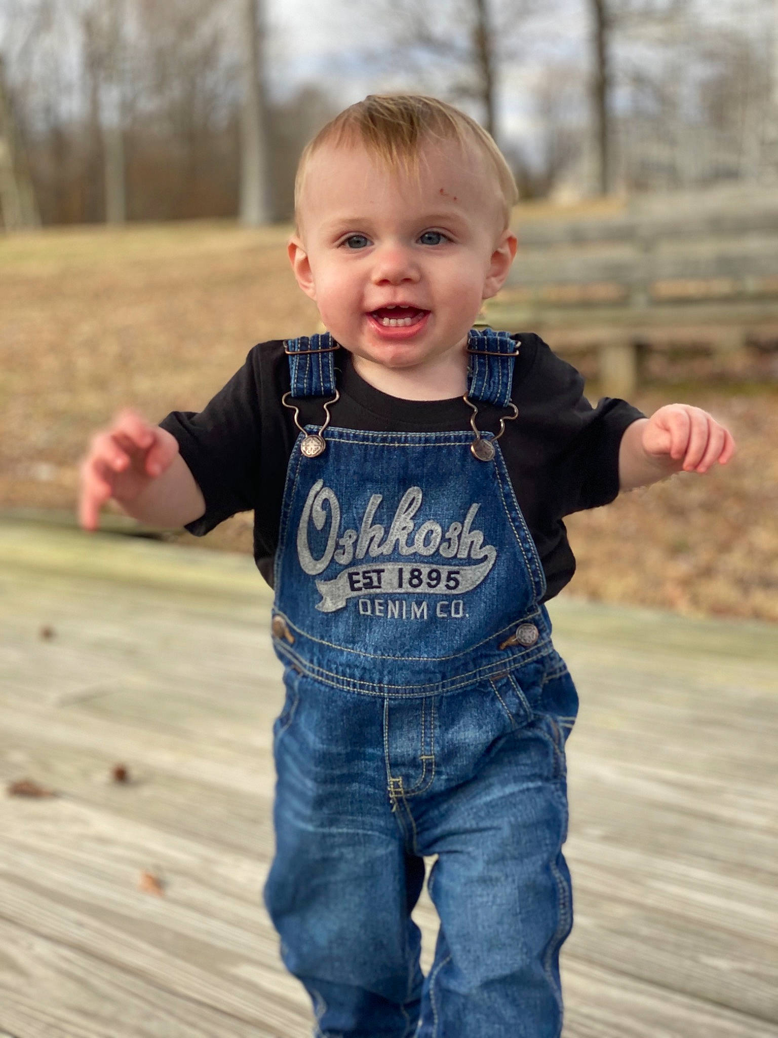 Greyson is registered to the contest to win money with this photo: baby, cheek, child, cool, denim, happy, jacket, jeans, outerwear, people, person, photography, play, sleeve, smile, standing, t_shirt, textile, toddler, tree