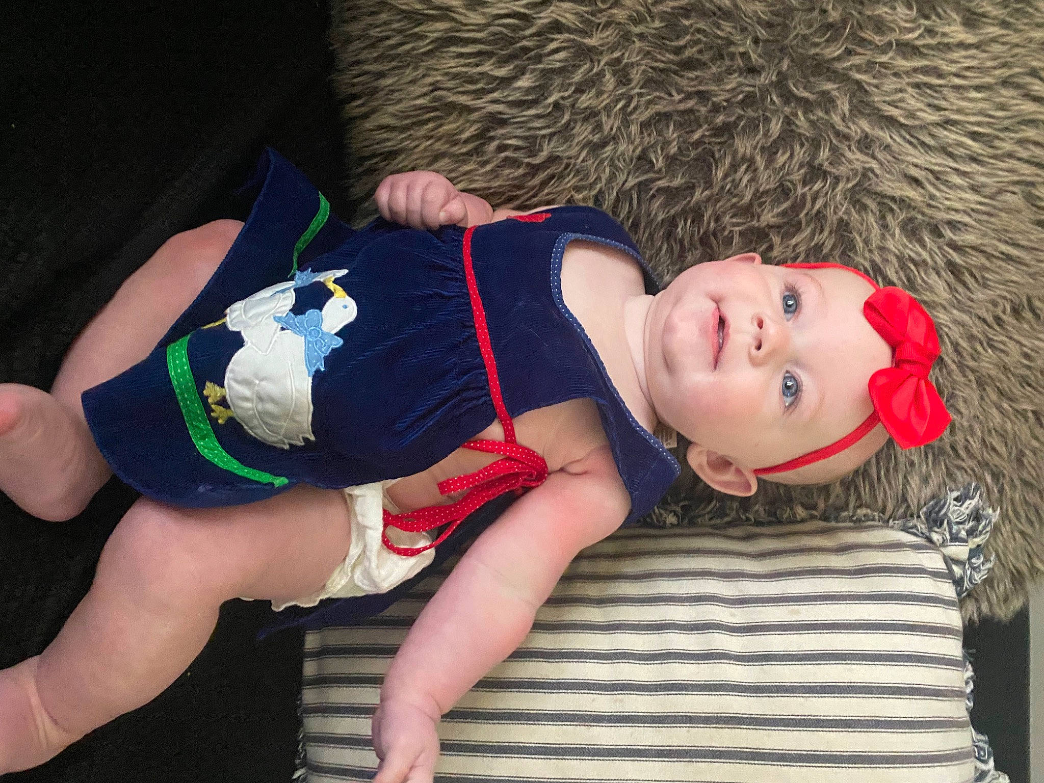 Elyanna is registered to the contest to win money with this photo: abdomen, child, costume, costume_hat, elbow, electric_blue, fun, fur, hat, headwear, human_leg, joint, knee, muscle, person, sitting, sportswear, thigh, tree, trunk