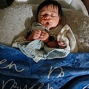 Brycen is registered to the contest to win money with this photo: baby, infant, sleeping, pacifier, blanket, crib, bedding, pillow, hands, face, hair, towel, swaddle, cozy, indoor, nap, peaceful, nursery, pacifier_clip, soft_texture