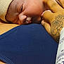 Brycen joined the competition — help win amazing prizes! baby, newborn, infant, face, hand, tattoo, hospital_band, beanie, sleeping, closeup, cheek, skin, parent, breastfeeding, torso, blue_clothing, fabric, nursing, skin_to_skin, gentle_touch