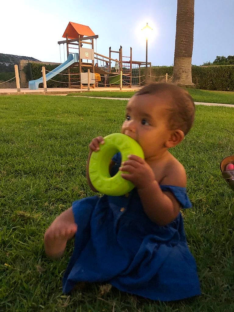 Carmen joined the competition — help win amazing prizes! baby, baby_toddler_clothing, ball, fruit, fun, grass, grassland, happy, house, landscape, lawn, leisure, people_in_nature, person, plant, recreation, sitting, sky, toddler, toy