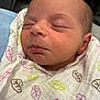 Juniper joined the competition — help win amazing prizes! newborn, baby, sleeping, blanket, swaddle, face, closed_eyes, infant, soft, peaceful, skin, head, cute, person, child, comfort, fabric, pattern, rest, young