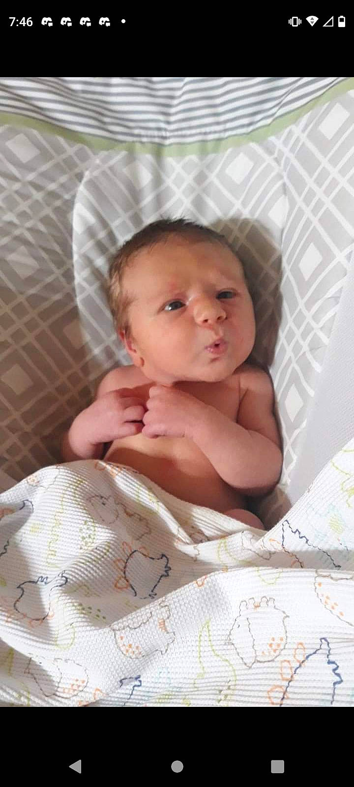 Leon is registered to the contest to win money with this photo: art, baby, baby_products, baby_safety, baby_sleeping, baby_toddler_clothing, bedding, bedtime, child, comfort, eyebrow, fashion_accessory, infant_bed, iris, linens, lip, pattern, person, room, sitting